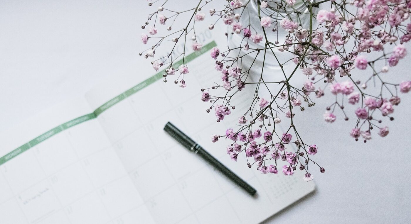 A monthly calendar on the desk — new calendar view options make scanning tracked time faster