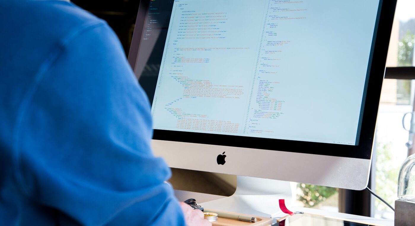 An attorney comparing billing platforms side by side on dual monitors — feature-by-feature evaluation is the heart of the Bill4Time vs Time59 decision