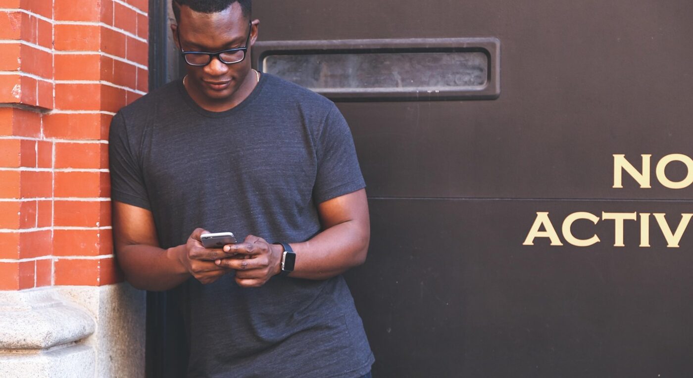 Logging time in a tracking app at the desk — automated capture records work the moment it happens