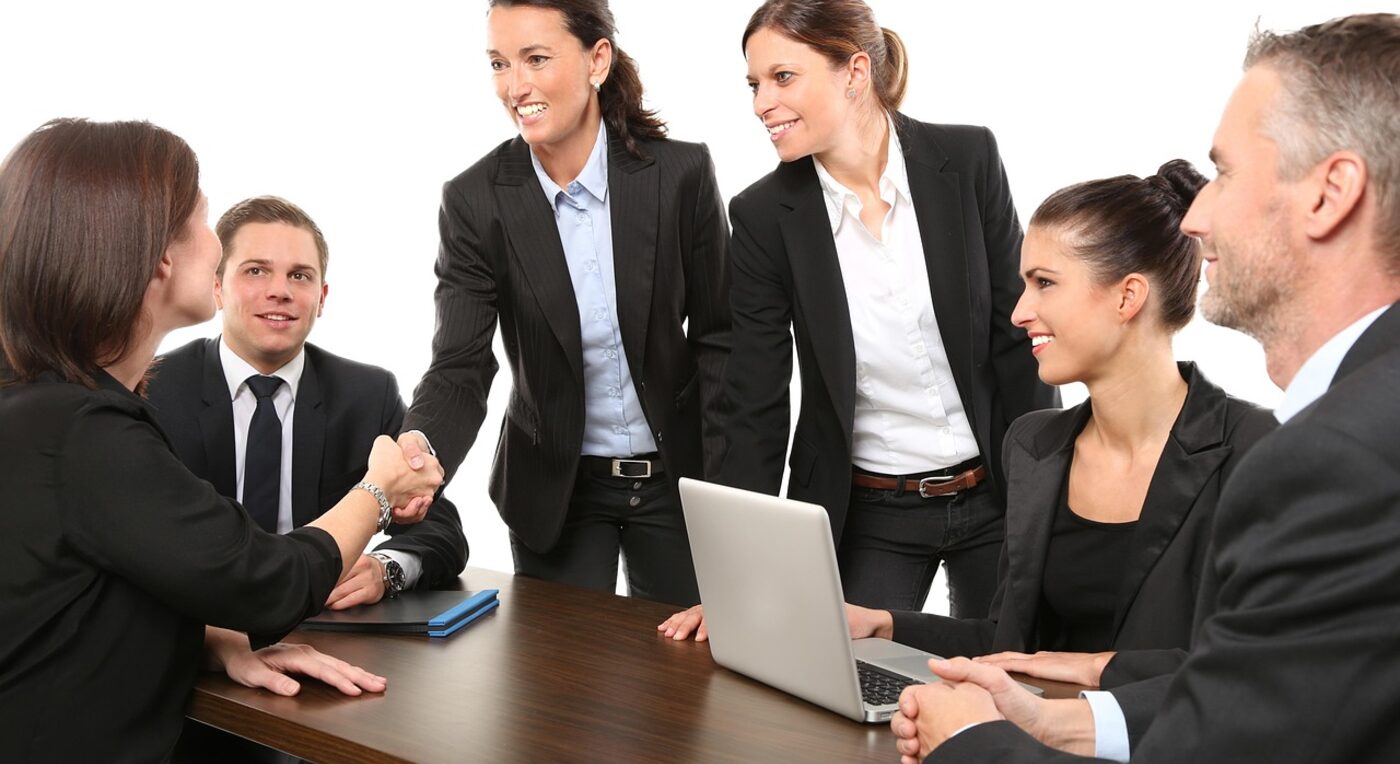 A handshake across the desk — fixed-fee arrangements give clients cost certainty up front
