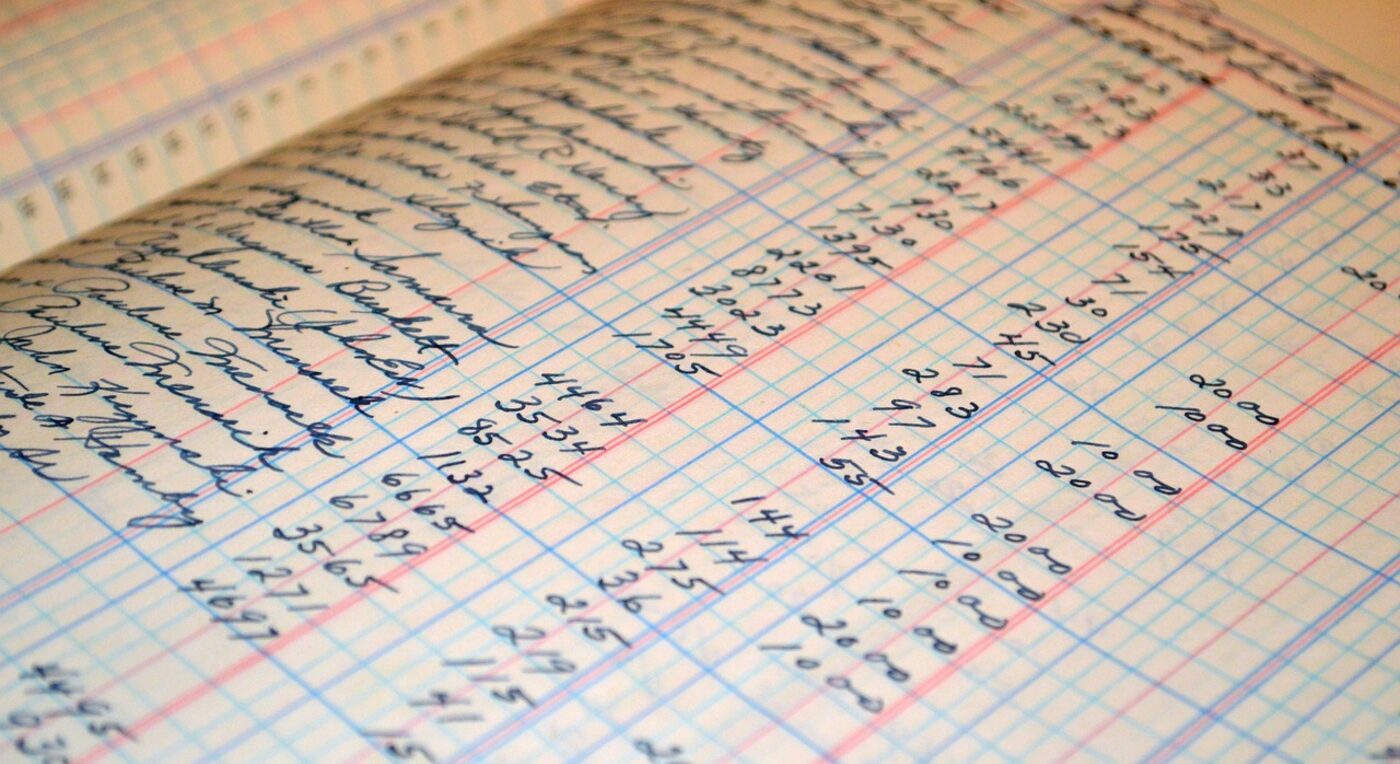 Recording figures in a ledger — evergreen retainers keep trust balances replenished as work proceeds