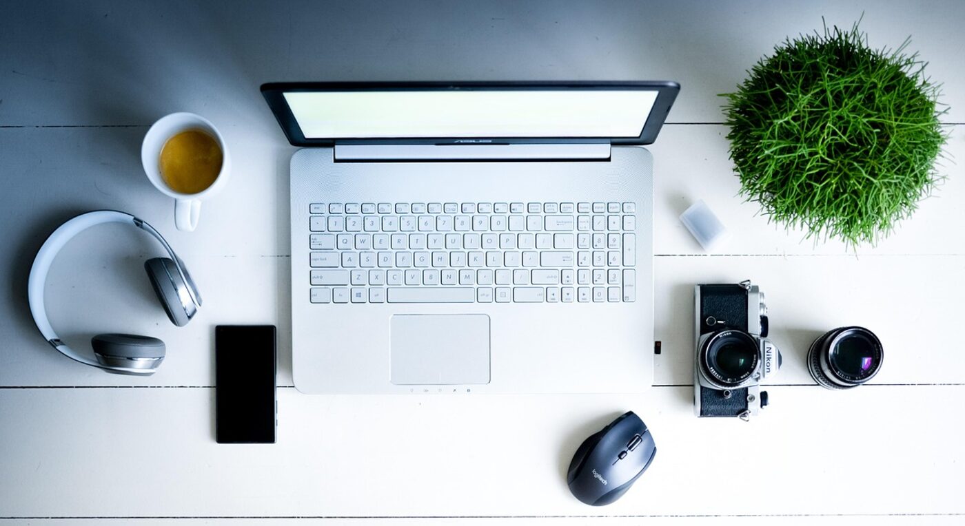 A tidy small-firm workspace with laptop and books — free billing tools often lack the legal-specific features solo practices need