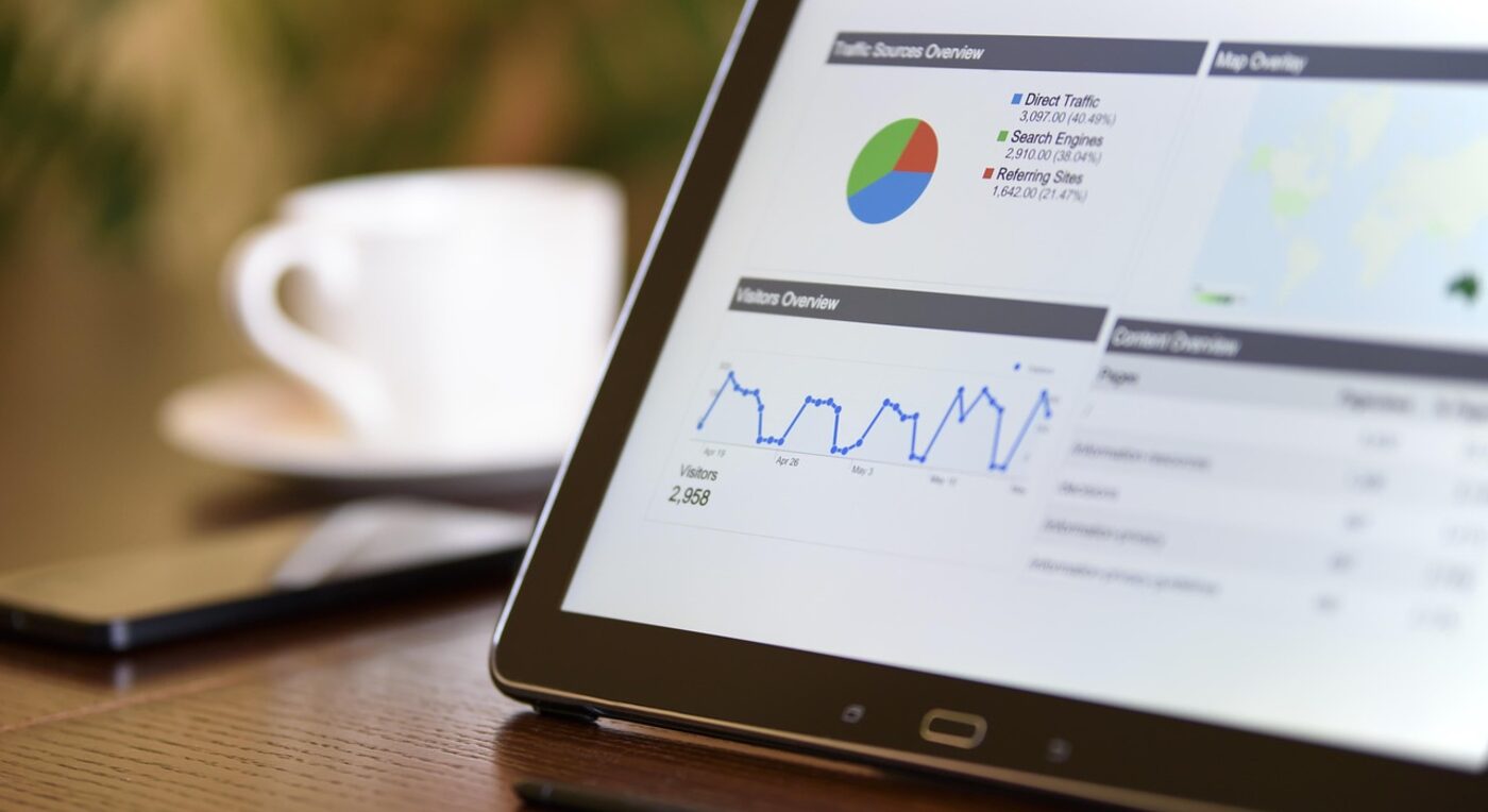 A professional reviewing financial charts on a tablet — direct feature and cost comparisons make the tradeoffs concrete